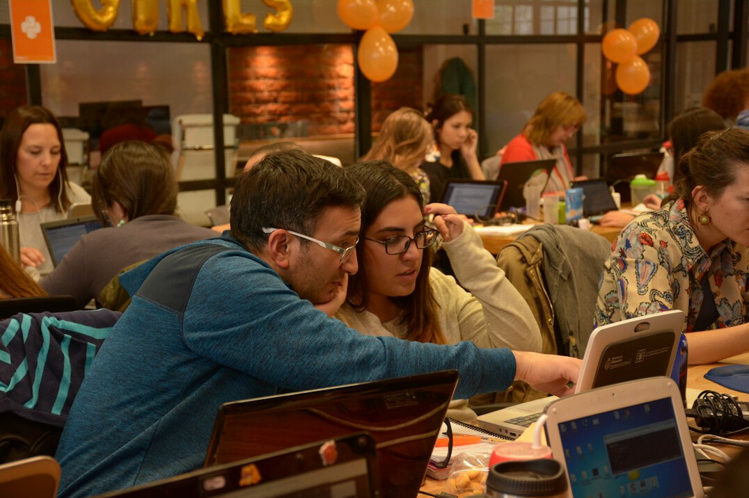students learning programming in classroom