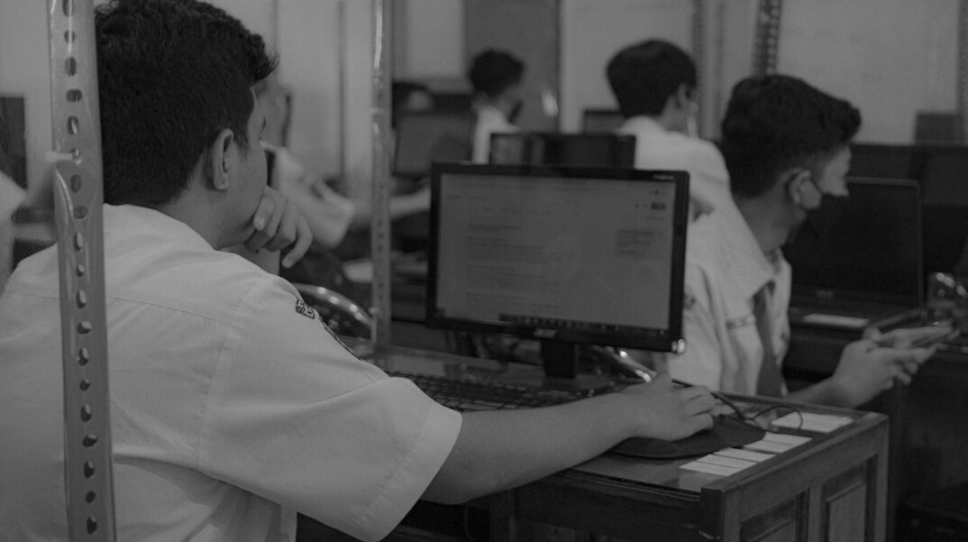 students learning programming in classroom