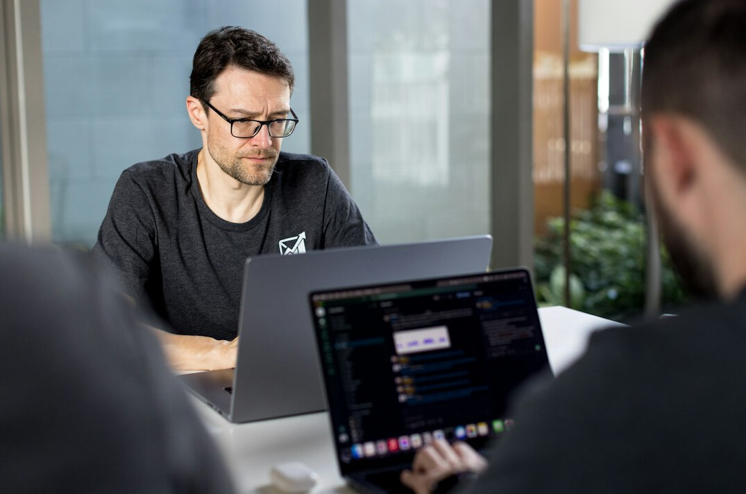 teacher explaining code to students