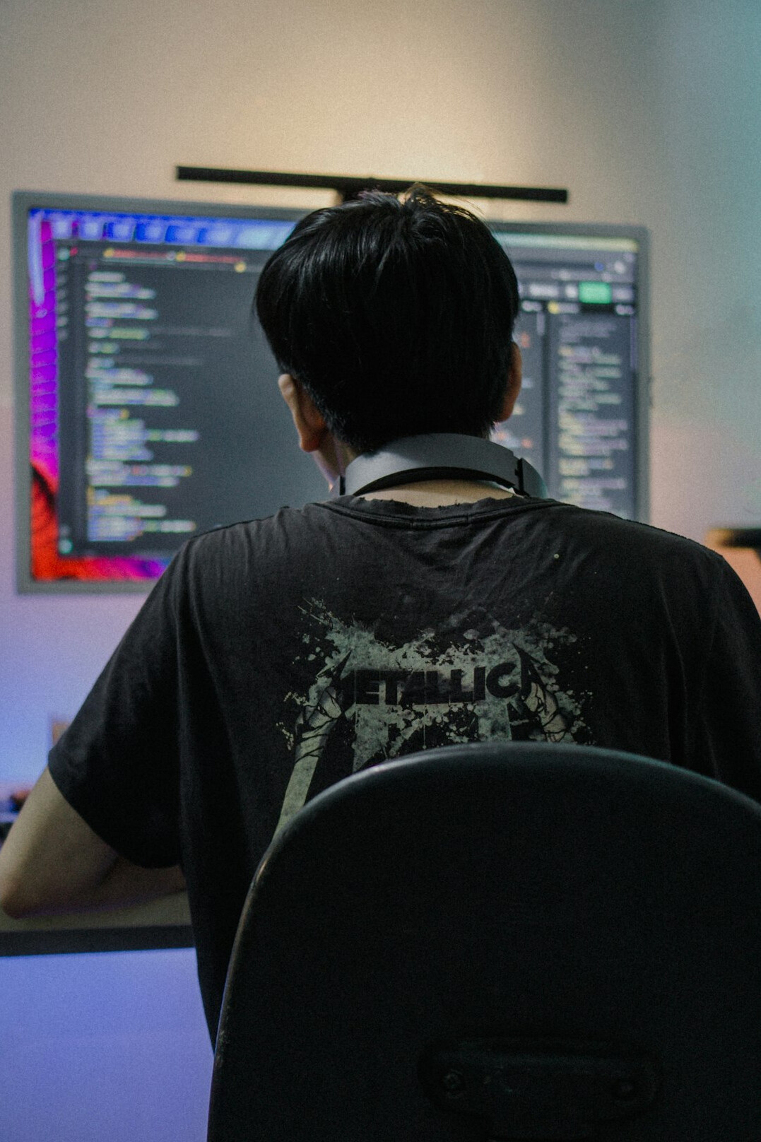 successful programmer at desk